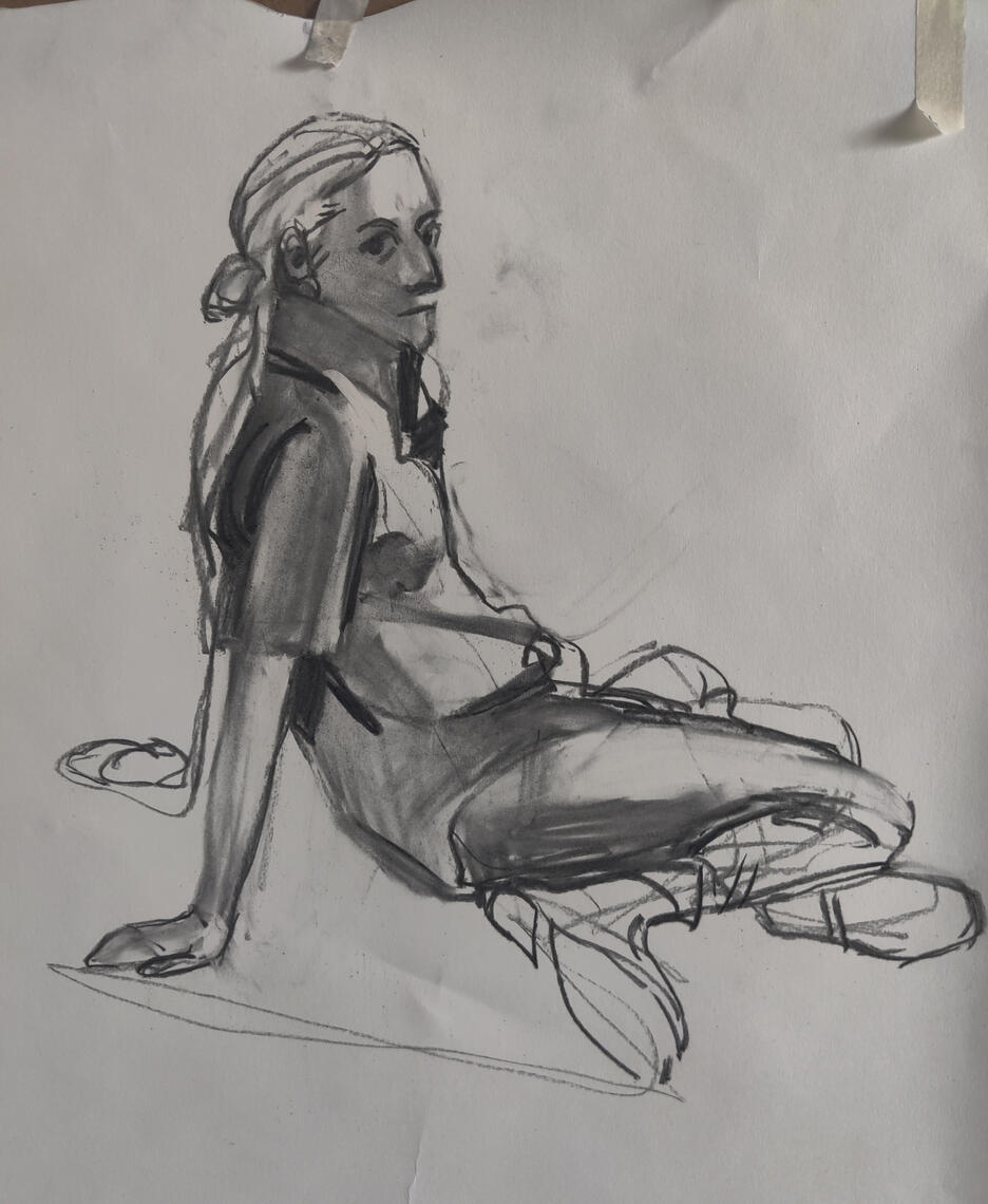 A graphite life drawing of a person reclining back on their hands. A graphite life drawing of a person reclining back on their hands.